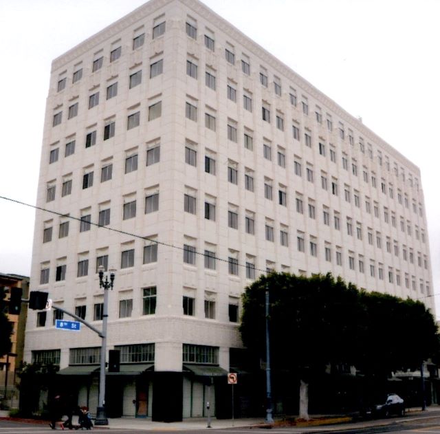 Before: similar view of front and side of Long Beach building from the opposite corner.